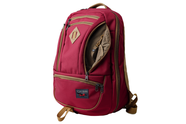 The Guide's Edition Synik 30 in Raspberry 630 Ballistic. Reddish pink backpack with gold accents on a white background